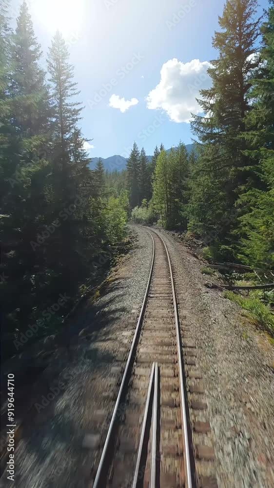 FPV drone is flying fast forward over railway track. Canada