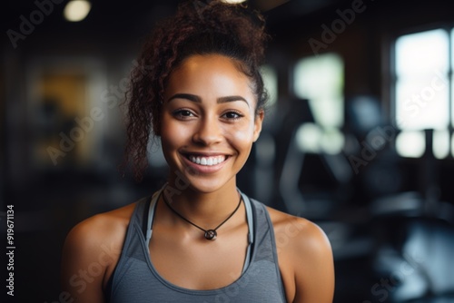 Free Download Portrait of a young female African American fitness trainer in gym - GFXLoad