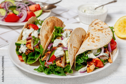 grilled chicken street tacos on a white plate