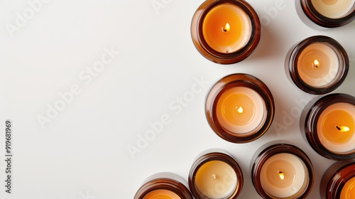 Handmade soy and coconut wax candles in amber and opaque jars on white background. Organic, trendy DIY candles. Vegan, with room for text. Banner design. photo