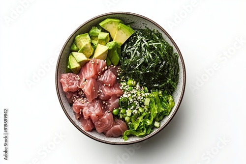 Tuna poke bowl with seaweed salad and avocado isolated on a white, top view