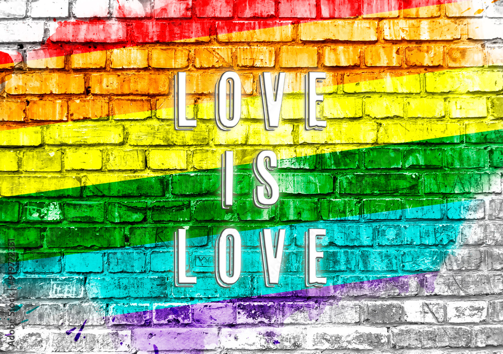 Fototapeta premium A colorful rainbow with the words love is written on it