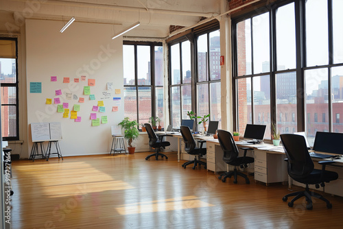 office space with walls, wooden floors and large windows overlooking the city