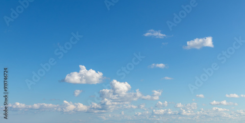 Photography Sky replacement small puffy white clouds coming in under blue sky