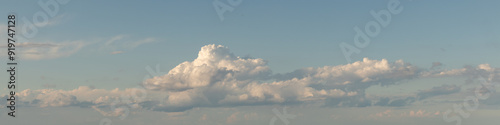 Sky replacement panoramic aqua sky with puffy clouds at horizon