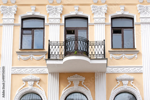 Building in Minsk with eclectic and neo-baroque elements, built in 1900 as an apartment building, located on Volodarskogo Str. Facades are finished with fluted pilasters with complex capitals. Balcony photo