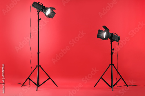 Red photo background and professional lighting equipment in studio