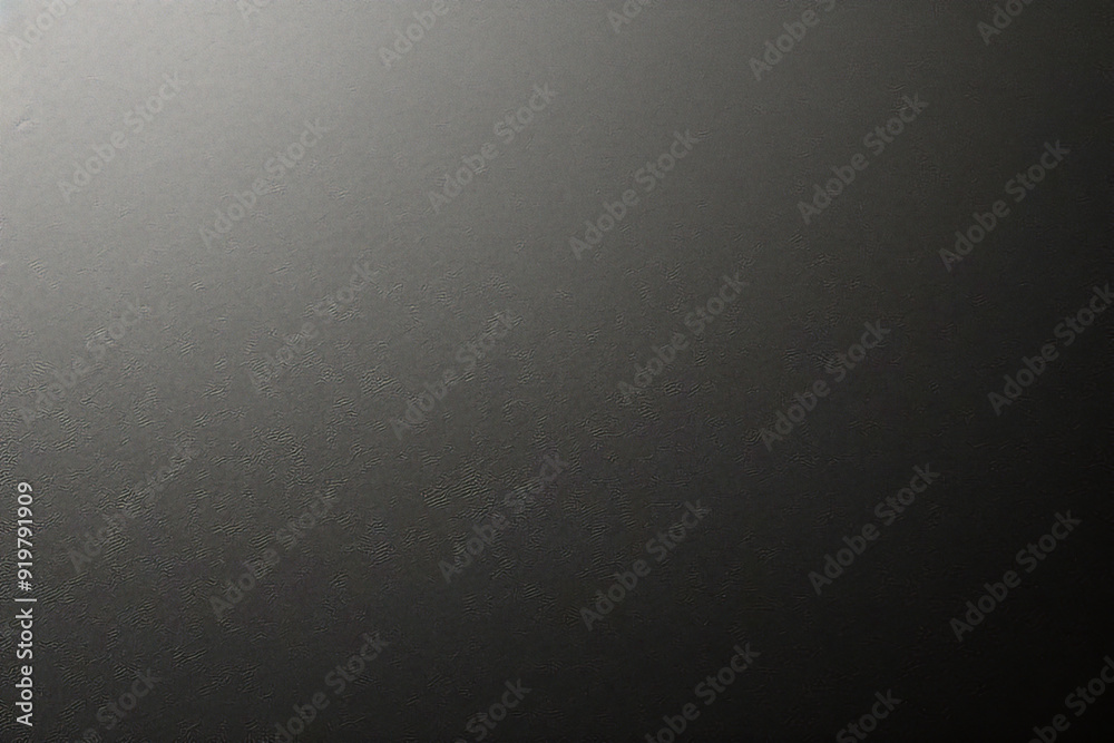 Black background made of real, shiny black paper covered with foil, illuminated by a soft light from above. Black background made of real, shiny black paper covered with foil, illuminated by a soft light from above.
