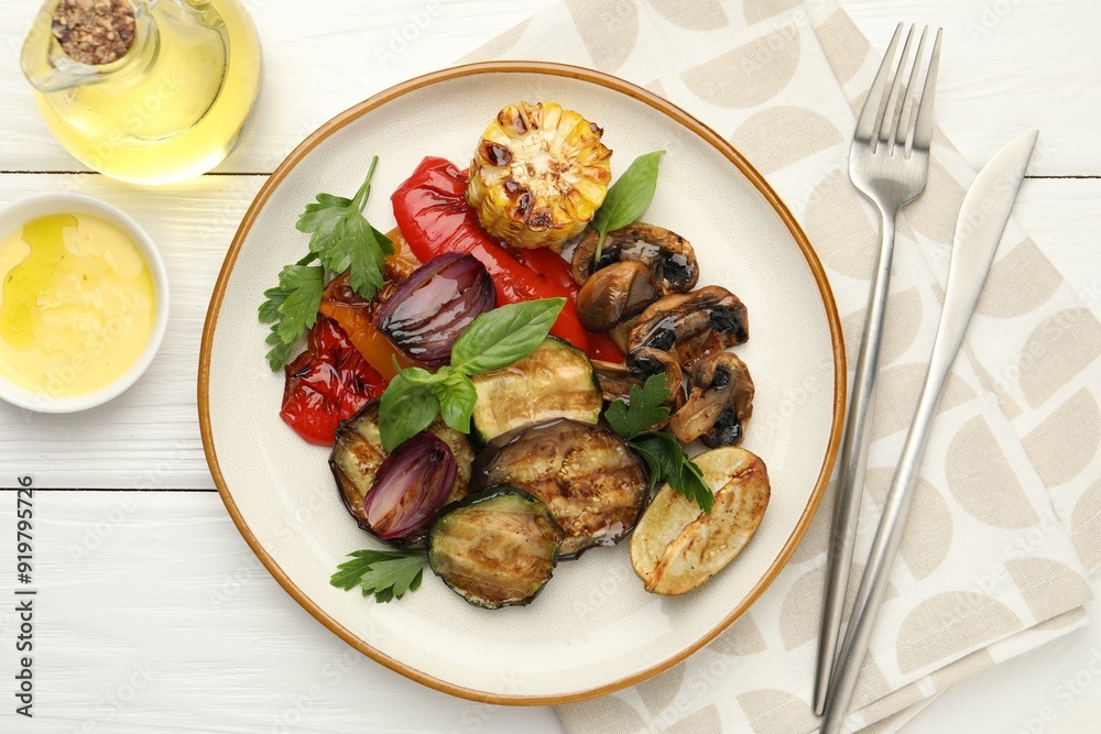 Delicious grilled vegetables with spices served on white wooden table, flat lay Delicious grilled vegetables with spices served on white wooden table, flat lay