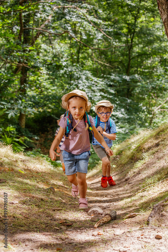 Young scout explorers hiking through a lush forest, having fun Young scout explorers hiking through a lush forest, having fun