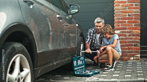 Принти на полотні Caring father teaching his loving child about repairing auto in yard