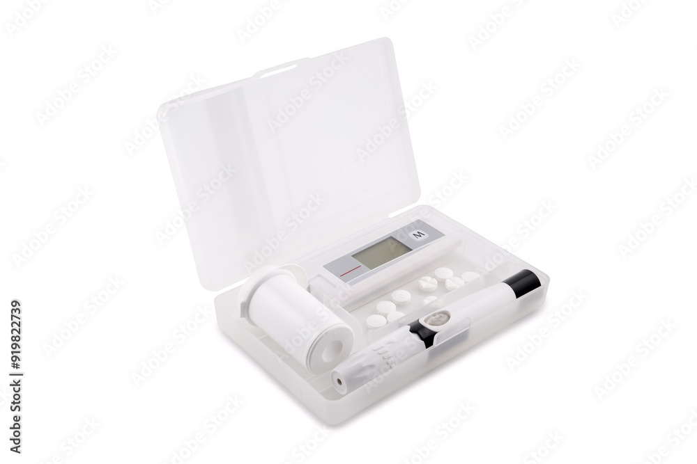 glucometer and lancet device in a plastic box glucometer and lancet device in a plastic box