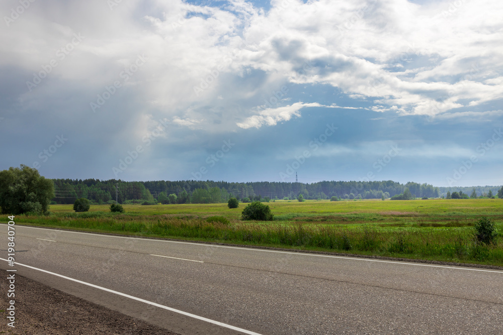 Lush green fields stretch under a dynamic sky, with clouds shifting as a gentle breeze sweeps across the peaceful countryside. Lush green fields stretch under a dynamic sky, with clouds shifting as a gentle breeze sweeps across the peaceful countryside.