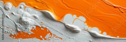 Abstract paint texture featuring white and orange swirls with bubbles, creating a microcosm effect and ample copy space photo