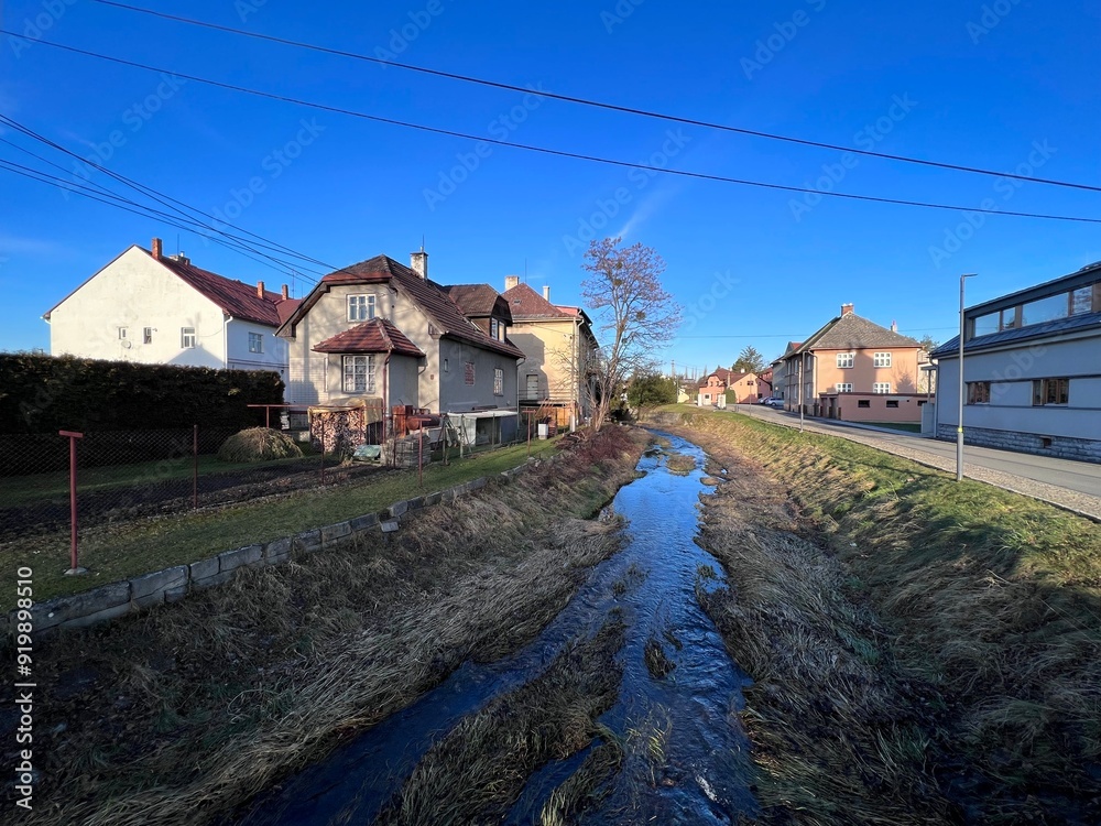 Olesná river flowing through the center of Palkovice village Olesná river flowing through the center of Palkovice village