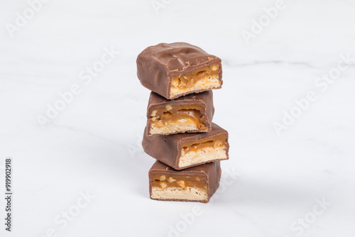 Fitness Candy bar with nougat, caramel, peanuts and hazelnuts. In milk chocolate