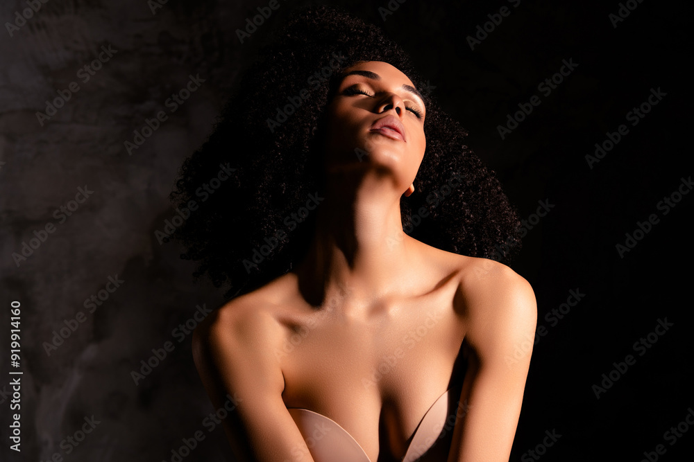 Photo of dreamy stunning lady nude shoulders loving body positive empty space isolated concrete black color wall Photo of dreamy stunning lady nude shoulders loving body positive empty space isolated concrete black color wall