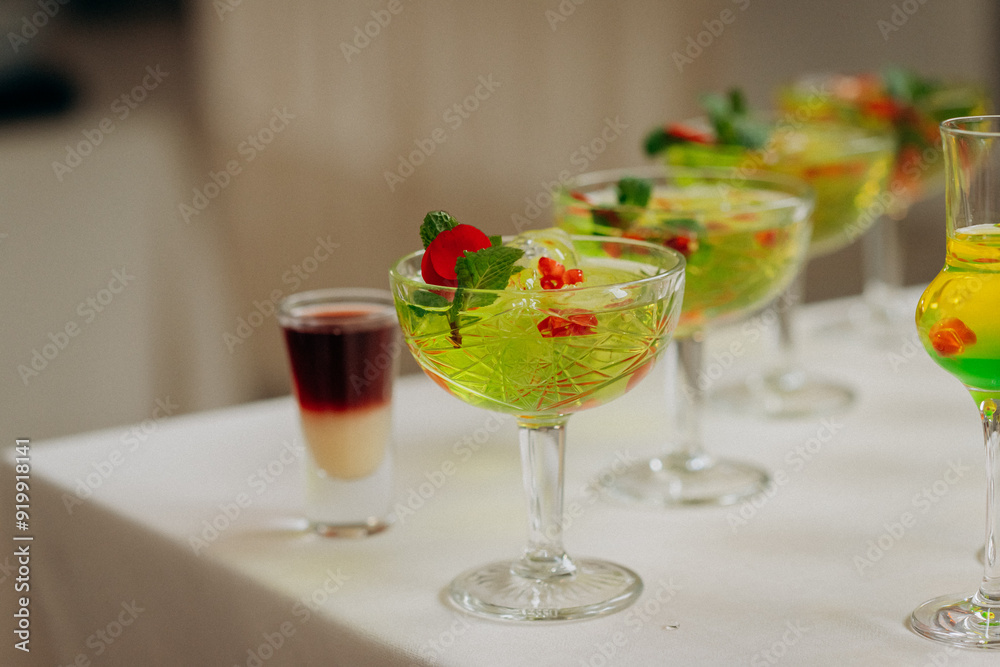 Welcome drink with cocktail glasses and drinks at an event. Alcoholic beverages at a wedding Welcome drink with cocktail glasses and drinks at an event. Alcoholic beverages at a wedding
