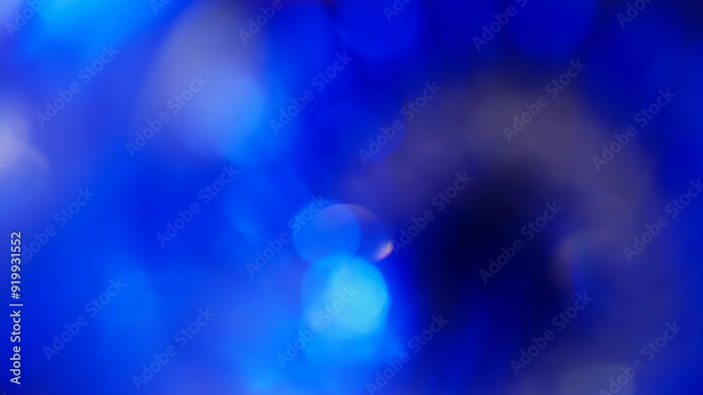 Real optical blue bokeh on black background
