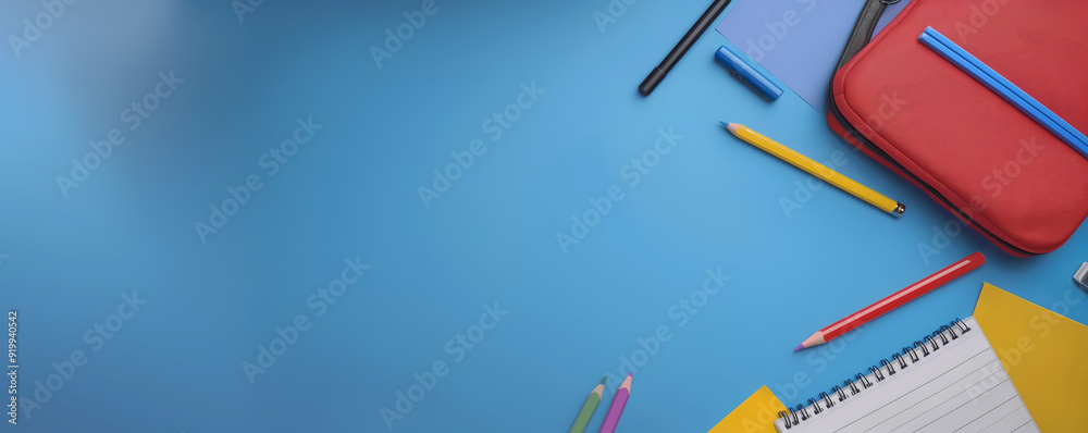 School supplies isolated on blue with empty space. Banner for text. Back to school concept School supplies isolated on blue with empty space. Banner for text. Back to school concept