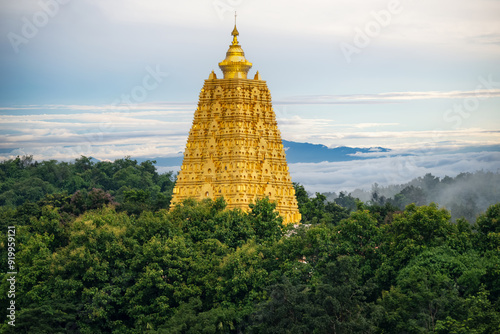 Beautiful landscape in the morning at the temple Golden Bodhakhaya Pagoda Chedi at Wat Wangwiwekaram Temple or Mon Temple, Sangkhla Buri District. photo