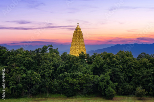 Beautiful landscape in the morning at the temple Golden Bodhakhaya Pagoda Chedi at Wat Wangwiwekaram Temple or Mon Temple, Sangkhla Buri District. photo