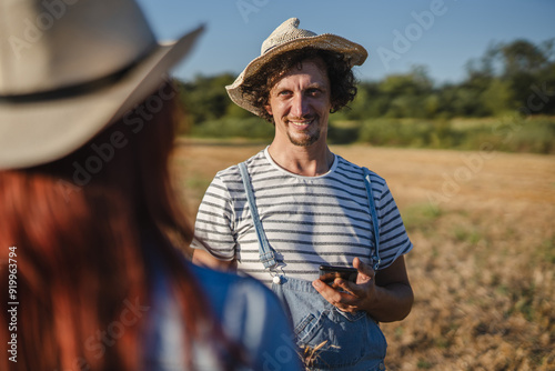 man farmer in the take a photo of example with mobile phone