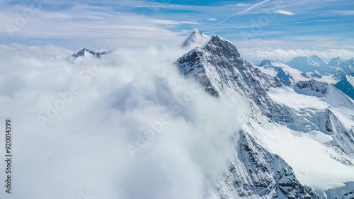 Aerial hyperlapse of Jungfrau at on a snowy day 