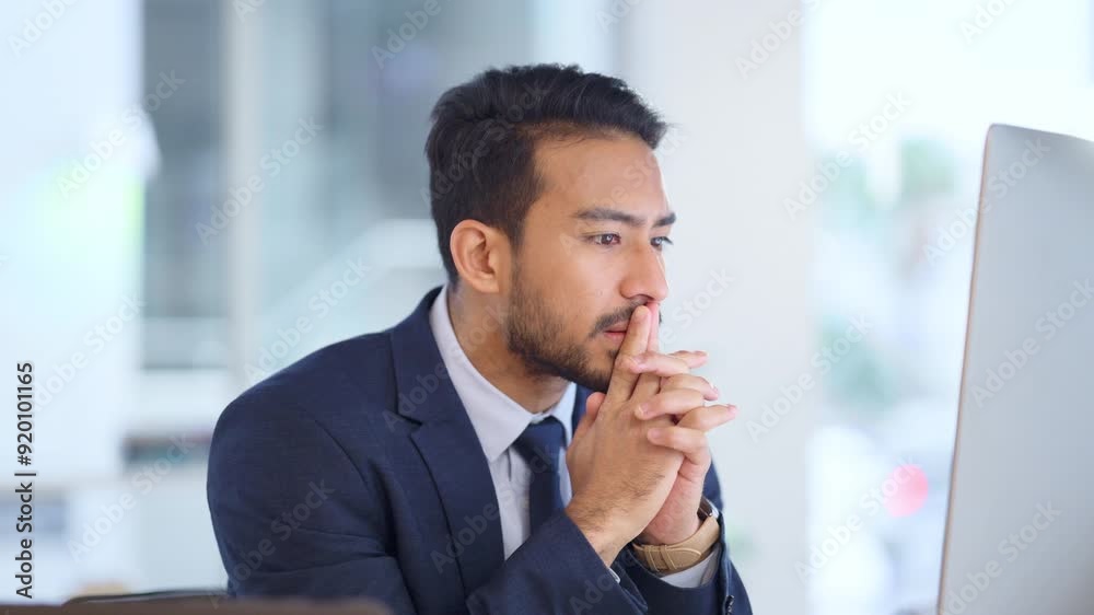 Frustrated data scientist struggling with fatigue and feeling the pressure to hit his deadline. Stressed web developer suffering with mental block while trying to code on a computer in his office.