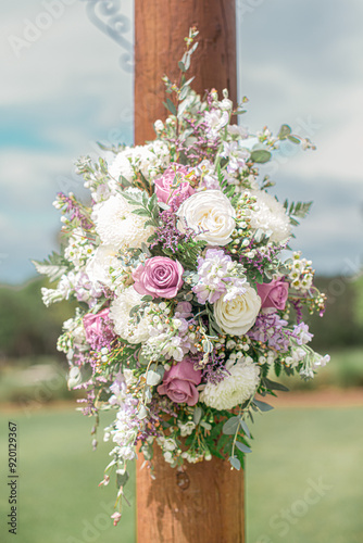 Amazing pink and white rose flower arrangement on wedding ceremony alter outdoors at wedding ceremony florida