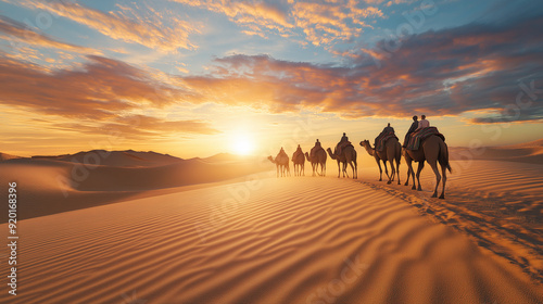 Camel caravan crossing desert dunes at sunset