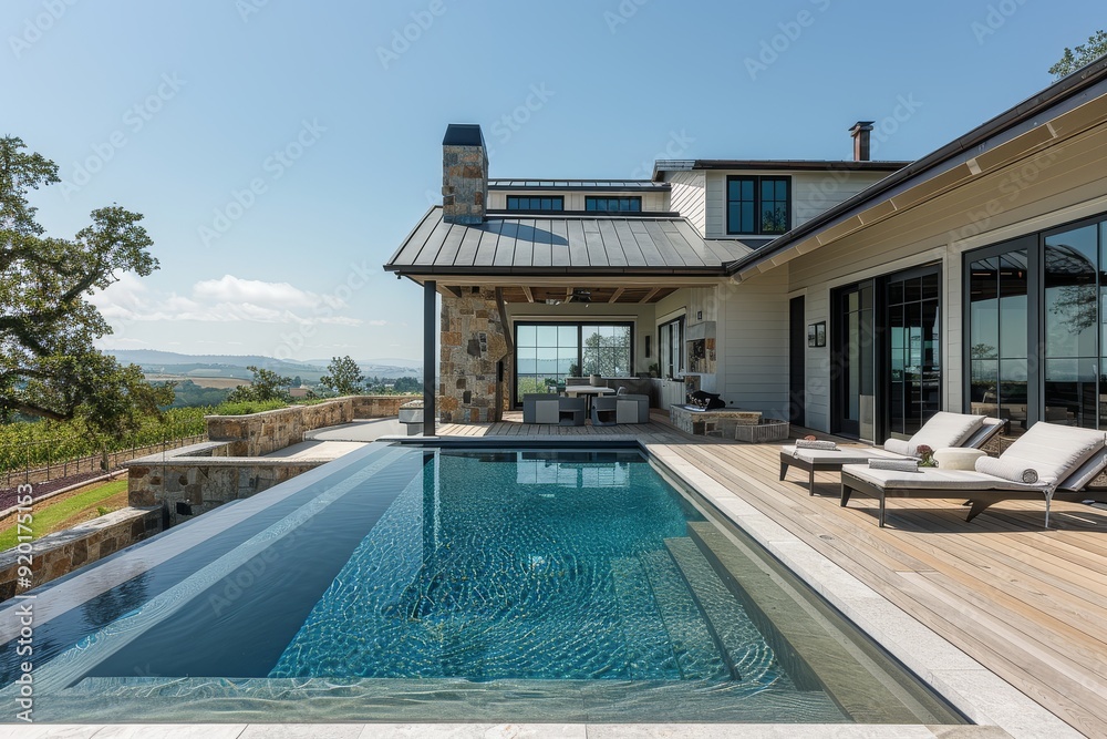 Obraz premium Modern farmhouse with large pool, stone accents, flat metal roof, black steel columns on covered porch, rectangular aluminum infinity pool, wood deck, Napa Valley landscape, blue sky, minimal editing 
