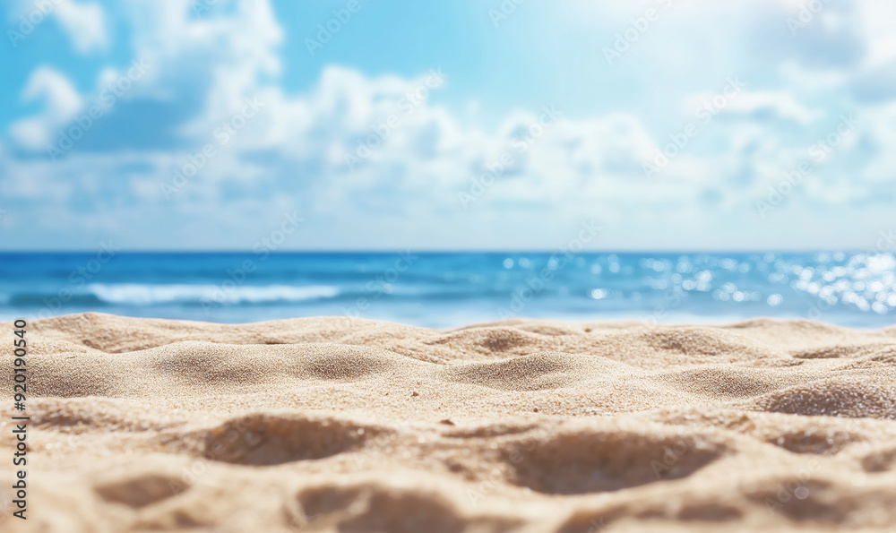 Beautiful summer background with a sandy beach and blue sky. Blurred empty space for product display, banner or design element. Summer vacation concept Beautiful summer background with a sandy beach and blue sky. Blurred empty space for product display, banner or design element. Summer vacation concept