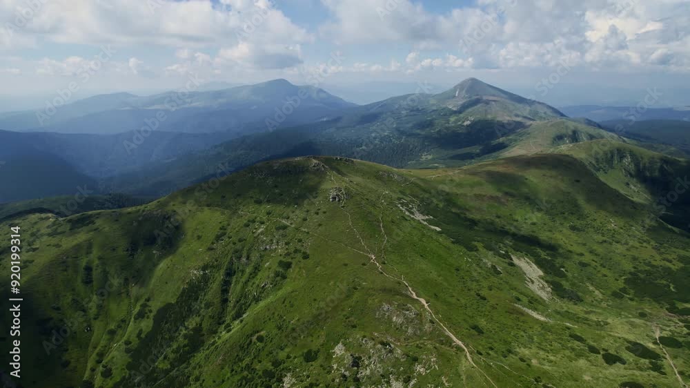 Aerial drone view of mountains, rocks and forest trees. Panoramic nature landscape of mountain peaks. Mountain valley, canyon with hiking trails for travelers in the summer. Trekking outdoors. Aerial drone view of mountains, rocks and forest trees. Panoramic nature landscape of mountain peaks. Mountain valley, canyon with hiking trails for travelers in the summer. Trekking outdoors.