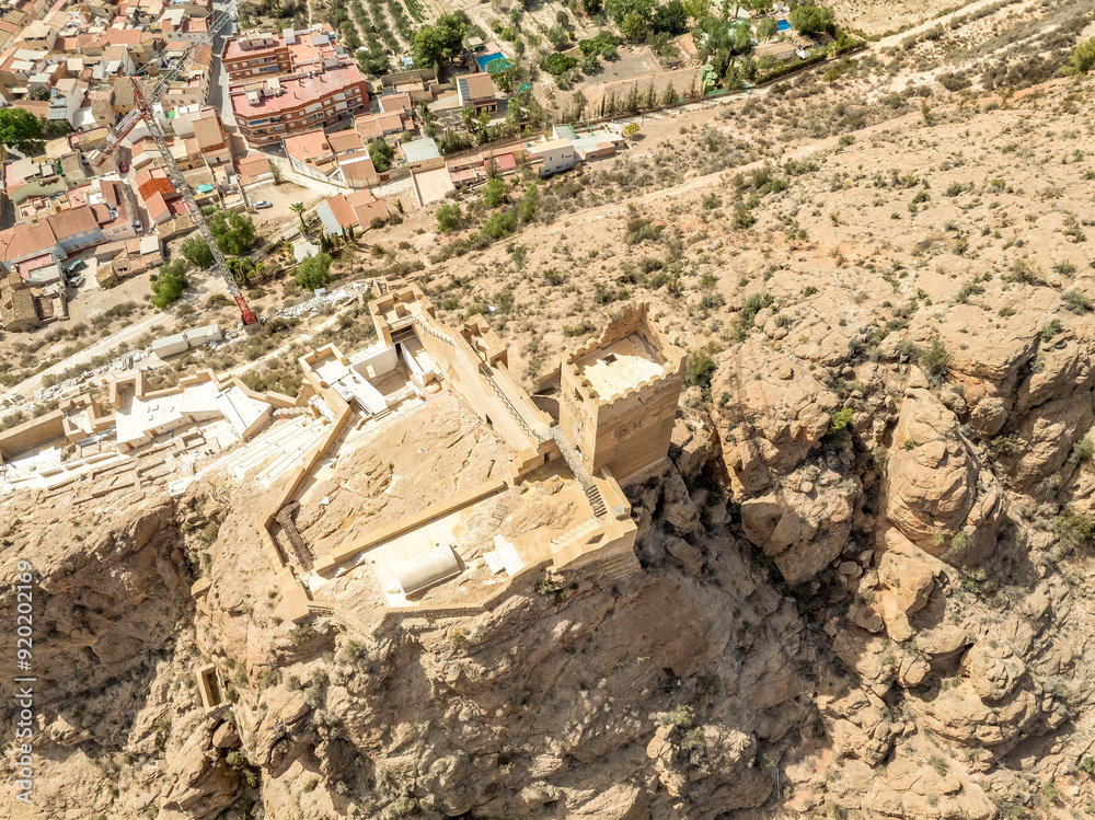 Φωτογραφία Aerial view of Alhama castle with large square keep restored using concrete and Iberian settlement ruins in Southern Spain Murcia province