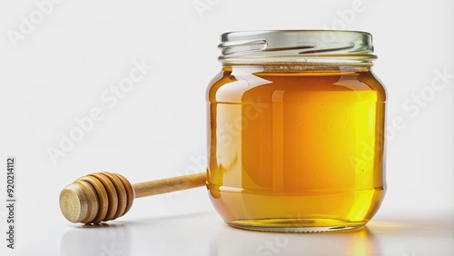 Clear glass jar filled with golden honey, isolated on white background, honey, jar, sweet, sticky, organic, natural, food