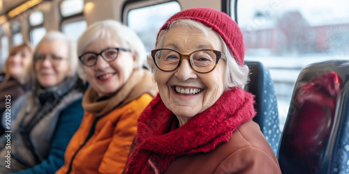 Group of senior women traveling by train are smiling