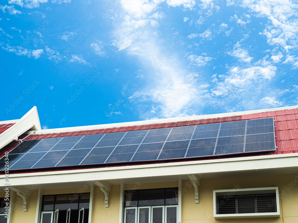 Naklejka premium Solar panel energy photovoltaic sun heat power system cell electric on roof mome modern new future green eco ecology station house plant technology renewable construction generator field rooftop