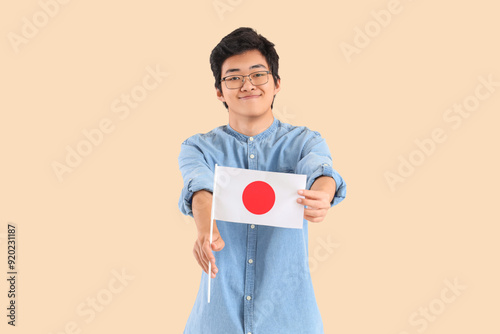Young Asian man with flag o...