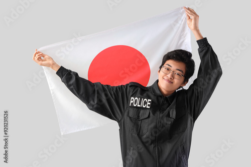 Young Asian police officer ...