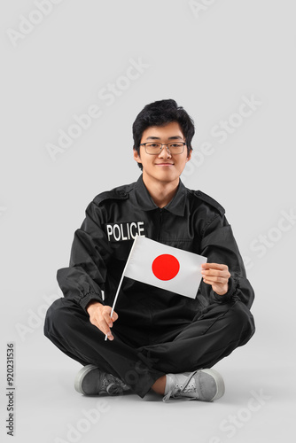 Young Asian police officer ...