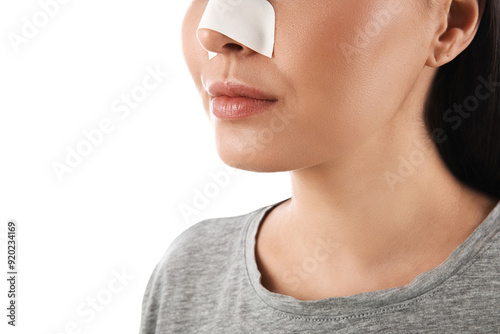 Young woman with bandaged n...