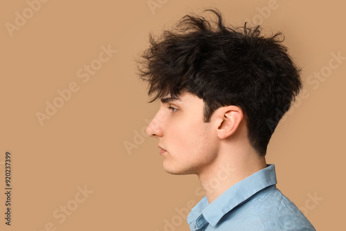 Young dark haired man on be...