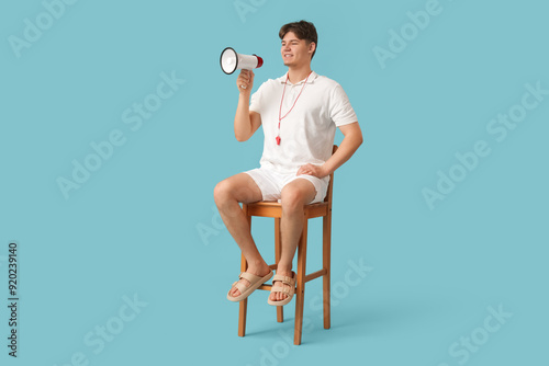 Male lifeguard with loudspe...