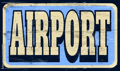 Aged and worn airport sign on wood