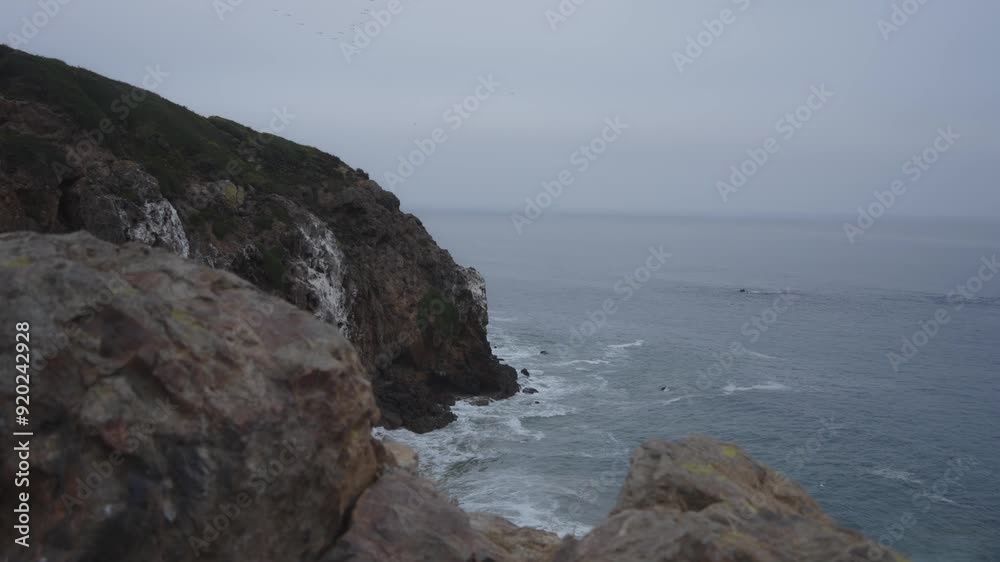 A tranquil view of the Malibu coastline with rugged cliffs and the gentle waves of the Pacific Ocean, capturing the serene beauty of California’s coast. A tranquil view of the Malibu coastline with rugged cliffs and the gentle waves of the Pacific Ocean, capturing the serene beauty of California’s coast.