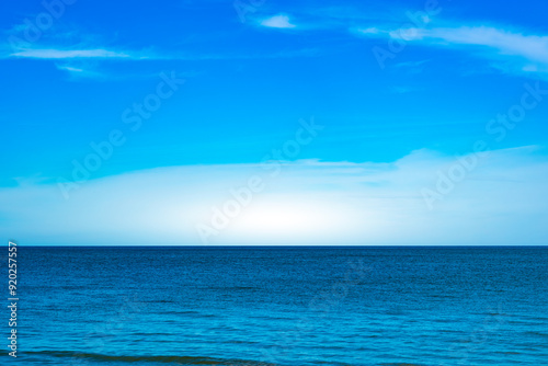 Nature of the beach and sea Summer with sunshine, sandy beaches, clear blue waters sparkling against the blue sky. On an island with good ecology and environment Background for summer vacation concept