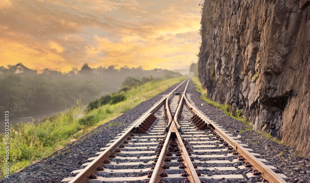 Fototapeta premium railway on mountain in sunset time