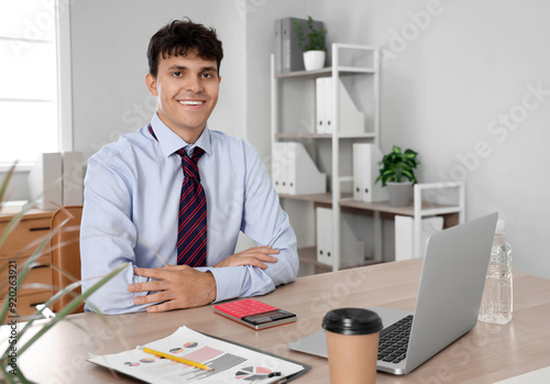 Male accountant with laptop...