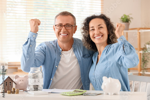 Happy couple with piggy ban...